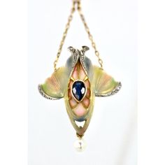 This Art Nouveau Pendant is special.  It is enameled in colors of Blue, Green, Pink and Cream. It also has a Pear shaped Blue Sapphire in the center and single cut Diamonds surround.  This shape is reminiscent of a tulip and it ends with a small natural pearl.  There is also another pearl that pulls the chain in the center.  This piece comes out of Great Britain and is lovely.  Art Nouveau necklaces are in great demand because there are few left.  This was done at the height of Art Nouveau jewelry my photos do not do it justice but we can only do the best we can.  This is priced to sell so do not wait, it will be gone. Art Deco Hallmarked Enamel Jewelry, Elegant Teardrop Enamel Jewelry, Elegant Enamel Jewelry With Cabochon, Elegant Oval Enamel Jewelry, Elegant Enamel Jewelry With Gemstone, Elegant Yellow Gold Jewelry With Artistic Design, Elegant Enamel Wedding Necklaces, Luxury Enamel Inlaid Jewelry, Elegant Pendant Jewelry For Art Collection