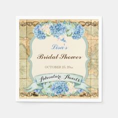 a blue and white floral bridal shower label on a square paper napkin with an ornate frame