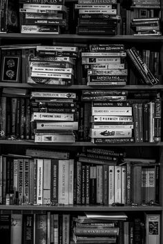 black and white photograph of books on shelves