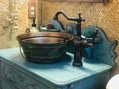 an old fashioned sink and faucet in a bathroom