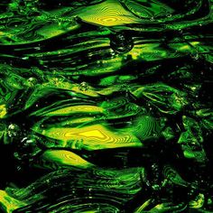 an abstract green and black background with wavy lines