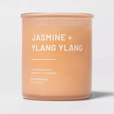 a candle with the label jasmine and ylang ylang on it