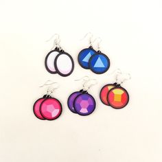 Made with faux leather and vinyl these crystal gem earrings are so lightweight, comfy, and versatile. Handcrafted in my home studio with original designs they are sure to be great addition to any style! *Follow the process and get to know me better: https://linktr.ee/maxrigby13 Find more in my shop: https://www.etsy.com/shop/rigbydesignsshop *Color Disclaimer* Colors may vary depending on the settings of your screen. Steven Universe Jewelry, Steven Universe Crystal Gems, Get To Know Me Better, Crystal Gems Steven Universe, Gem Earrings, Get To Know Me, Crystal Gems, Steven Universe, Favorite Jewelry