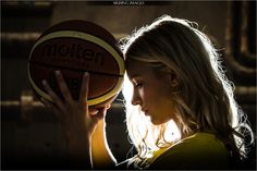 a woman holding a basketball in her hand with the words mellie official on it