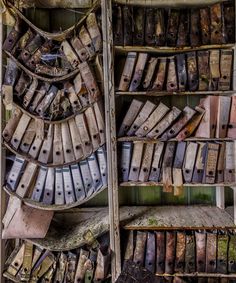 an old book shelf filled with lots of books and other items in it's storage area