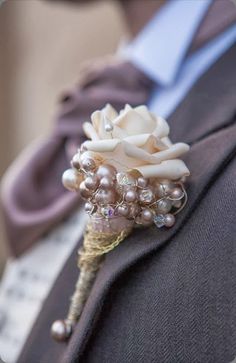 a boutonniere is adorned with pearls