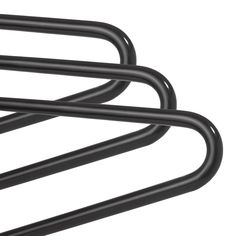 three black metal bars are stacked on top of each other in order to hold the bar