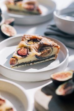 a slice of pie sitting on top of a white plate next to other desserts