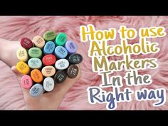 someone holding up some markers in their hand with the words how to use alcoholic markers in the right way