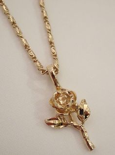 The Rose Necklace is a blooming beauty. It's the ultimate golden rose necklace that is sure to make all other rose flower necklaces jealous. This dainty darling features a diamond cut rose pendant and is available in a silver rose necklace too! Available in 24K gold or rhodium plating over steel Patent plating & sealant technology to ensure durability and long lasting wear Made in Los Angeles, CA | Nickel & Lead Free Flower Necklaces, Pretty Jewelry Necklaces, Golden Necklace, Jewelry Accessories Ideas, Rose Pendant, Golden Rose, Rose Necklace, Classy Jewelry, Rose Jewelry