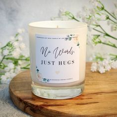 a white candle sitting on top of a wooden board