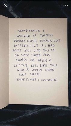 an open book with writing on it and someone's handwritten poem in blue ink