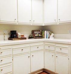 the kitchen is clean and ready for us to use it's white cabinetry