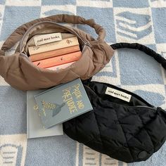 a purse with books and a book bag on the floor