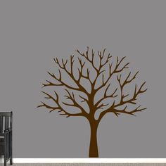 a tree with no leaves on it is shown in the corner of a living room