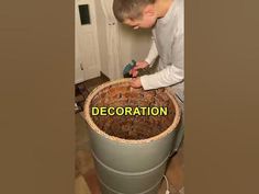 a man is working on a large bucket