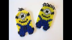 two yellow and blue knitted mittens sitting next to each other