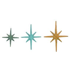 three metal stars on a white background, one is blue and the other is gold