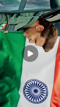 a woman laying on top of an italian flag