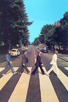 an image of the beatles walking across the street