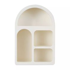 an arch shaped shelf with three compartments on each side and two shelves in the middle