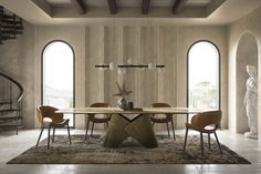 a dining room table surrounded by chairs and an area rug that looks like it has been designed in the style of art deco