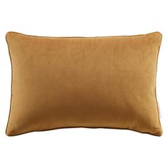 a brown pillow on a white background