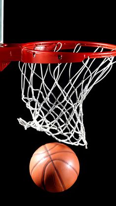 a basketball is going through the net with it's end in the air,