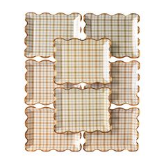 four brown and white checkered plates with scalloped edges