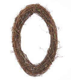 a wreath made out of twigs on a white background