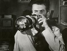 a man holding a camera up to his face