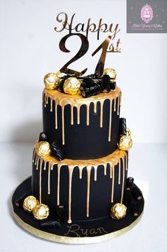 a black and gold birthday cake with chocolate drizzles