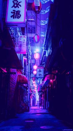 an alley way with lights and signs on it