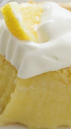 a piece of lemon pie with whipped cream on top