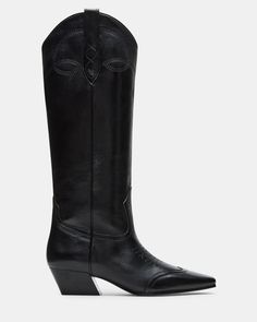 The DOLLIE Western boot offers a sleek and stylish design with a square toe. Experience comfort and durability with every step. Elevate your wardrobe with this timeless and versatile statement piece. 1.75 inch heel height Size 6 measurements: 15 inch shaft circumference, 13 inch shaft height Size 8 measurements: 16 inch shaft circumference, 14 inch shaft height Size 10 measurements: 17 inch shaft circumference, 14.75 inch shaft height Leather upper material Textile and synthetic lining Synthetic Knee-high Boots With Stacked Heel And Snip Toe, Classic Wide Calf Heeled Boots With Square Toe, Classic Square Toe Wide Calf Heeled Boots, Classic Tall Boots, Classic Wide Calf Boots With Square Toe, Classic Wide Calf Boots With Low Heel, Classic Fitted Mid-calf Boots, Classic Spring Heeled Boots With Square Toe, Classic Wide Calf Low Heel Boots