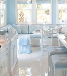 a white and blue kitchen with lots of counter space