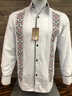 Mexican Guayabera.  Handcrafted in Merida, Yucatan Mexico. Made out of Cotton & Polyester Fabric Blend Red and Black Cross Stitch Embroidery Two Embroidery Panels Long Sleeve.  Beautiful and Elegant Guayabera Shirt.  Traditional Mexican Shirt  Good for Casual wear, Wedding, Fiesta, Tropical, Birthday or any other occasion. 100% Brand New  New Inventory  Please refer to size chart for proper fitment.  We gladly accept returns with these terms and conditions.  We do charge a 25% Fee on any returns. This helps compensate for shipping fees, packing supplies and labor costs.  Exchanges have no cost.  Customer is responsible for shipping items back.  We do not provide prepaid labels.  Items should be returned just as received and with no damages or signs of wear. No returns on Clearance Items. Traditional Festive Shirt With Floral Embroidery, Festive Traditional Shirt With Floral Embroidery, Traditional Floral Embroidered Shirt For Festive Occasions, Traditional Long Sleeve Wedding Wear With Woven Motifs, Traditional Wedding Wear With Woven Motifs And Long Sleeves, Traditional Embroidered Shirt For Formal Occasions, Traditional Fit Embroidered Shirt, Traditional Long Sleeve Shirt With Intricate Embroidery, Traditional Long Sleeve Shirt With Patterns