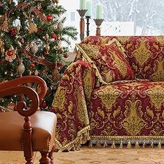 a living room with a christmas tree in the corner and a couch next to it