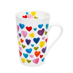 a white coffee cup with multicolored hearts on it