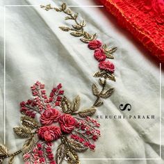 a close up of a piece of cloth with flowers and leaves on it, along with the words suruchi parkh