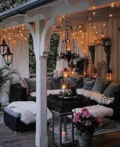 an outdoor living area with lots of lights