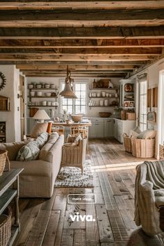 a living room filled with furniture and wooden floors