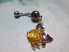 belly button ring yellow and purple fish purple stone stainless steel belly button jewelry 14 gage surgical steel https://www.etsy.com/shop/sindys Purple Fish, Belly Button Piercing Jewelry, Belly Piercing Jewelry, Belly Button Jewelry, Belly Jewelry, Body Jewelry Piercing, Yellow And Purple, Nose Jewelry, Belly Button Ring