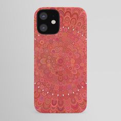 an orange and pink phone case with circles on it