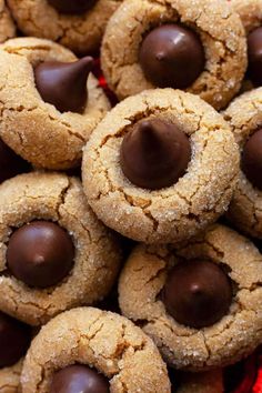 chocolate covered cookies are piled on top of each other