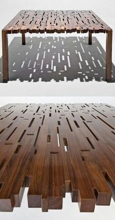 a table made out of wooden planks on top of a white surface with shadows