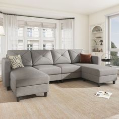 a living room with a large gray sectional couch