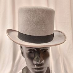 Broadway Quality, Made In Usa, 100% Wool Top Hat. Crown: 5-Inch High / Brim: 2-Inch Wide. This Is The Perfect Moderately Priced Top Hat Without The Cheap Look. This Hat Is Often Worn For Formal Wear Events. Color: Black, Brown, Gray American / Nearest 1/8 Inch / Metric Cm / Size Code 6 3/4 21 1/8 54 Small 6 7/8 21 1/2 55 Small / Child L 7 1/2 23 1/2 60 X-Large 7 5/8 23 7/8 61 X-Large These Hats Are Of High Quality And No Longer Manufactured So The Sizes And Quantity Available Are Finite. We Classic Gray Brimmed Hat, Classic Gray Hat With Short Brim, Classic Gray Fedora Hat, Classic Gray Flat Brim Hat, Classic Gray Hat Bands With Flat Brim, Classic Gray Flat Brim Hat Band, Classic Adjustable Top Hat For Winter, Classic Short Brim Winter Costume Hat, Classic Short Brim Costume Hat For Winter