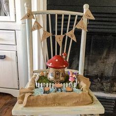 a white chair with a mushroom house on it