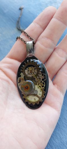 One of a kind statement steam punk spoon pendant, mixed and matched pieces of vintage watch parts together with other elements to form a unique design especially for you. lastly fill up with two parts glass alike resin to permanently sealed up the art work. Build time: 3 days Day 1 : apply background paint Day 2 : design and match pieces together Day 3 : apply resin  This spoon measures approx 1 inch width and 2.5 inch height including the loop. It comes with an estimate 27 inches long bronze ne Spoon Pendant, Background Paint, Old Watch, Steampunk Watch, Steam Punk Jewelry, Steampunk Accessories, Bronze Necklace, Old Watches, Watch Parts